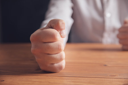male fists on the table .の写真素材