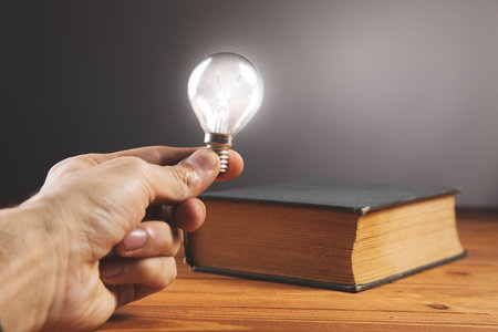 light bulb and book on the table new ideas