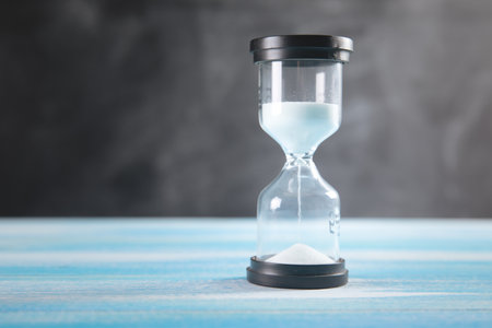 hourglass on wooden background .
