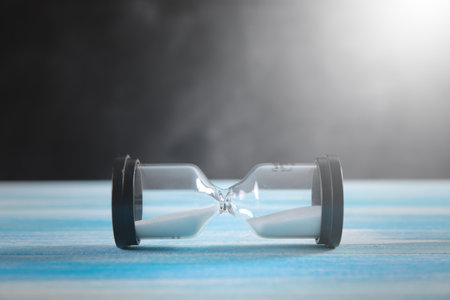 hourglass on wooden background .