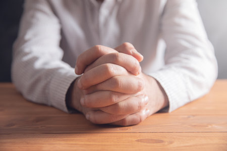 praying on wooden background .の写真素材