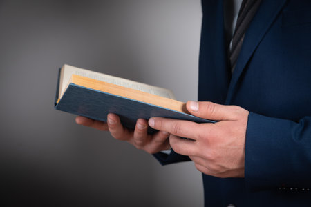 young businessman reading a bookの写真素材