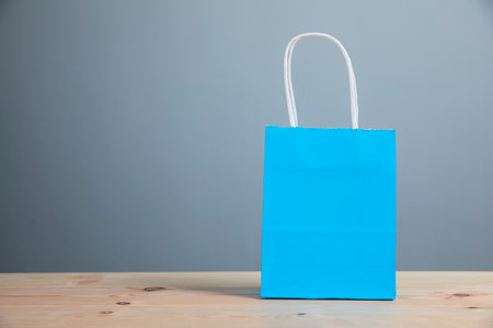 gift blue bag on the tableの写真素材