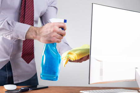 clean the computer screen with a rag .の写真素材