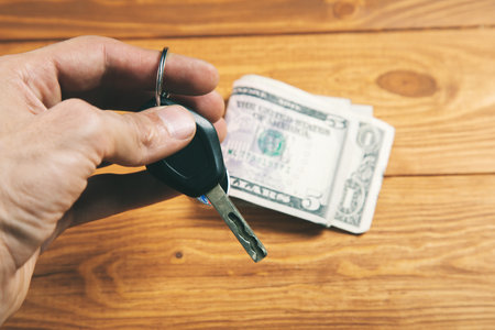car keys and money buy new carの写真素材