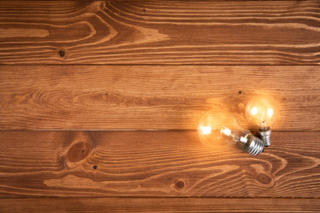 glowing lamp on a wooden table. concept ideasの写真素材