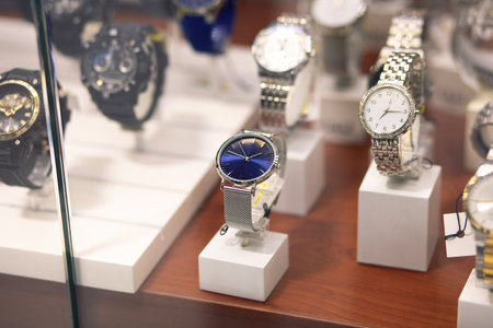 expensive watch on a glass shelfの写真素材