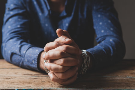 the man sits in chains. prisoner conceptの写真素材