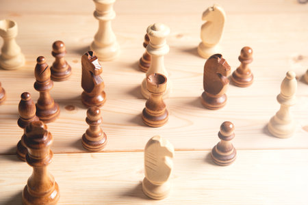 wooden chess pieces on wooden background