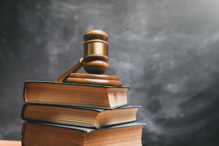 gavel of the judge on the books on a dark background