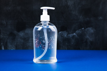 can of antiseptic on a blue tableの写真素材