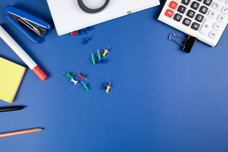 school supplies on the blue tableの写真素材