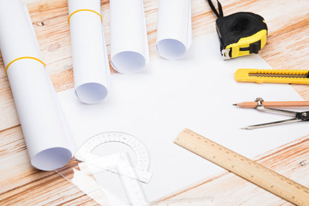 tools for designing a house on a wooden tableの写真素材