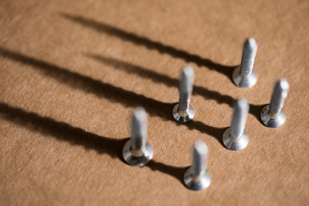 screws on the table on the macro lensの写真素材