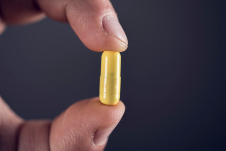 man holding a yellow pillの写真素材