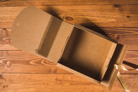 open brown gift box on the tableの写真素材