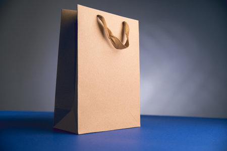 gift brown bag on blue table