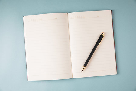 notebook and pen on the table