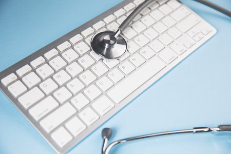 stethoscope on keyboardの写真素材