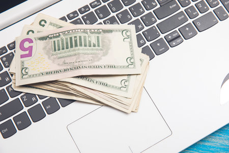 money on a white laptopの写真素材