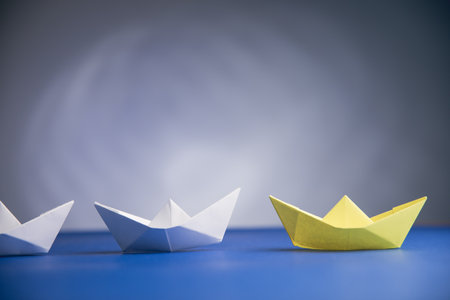 paper boats on the table on a gray backgroundの写真素材