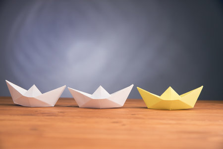 paper boats on the table on a gray backgroundの写真素材