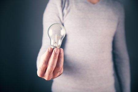 a man holding a lampの写真素材