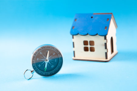 compass and house on a blue backgroundの写真素材