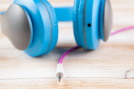 big blue headphones on the tableの写真素材