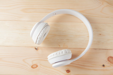 big white headphones on the tableの写真素材