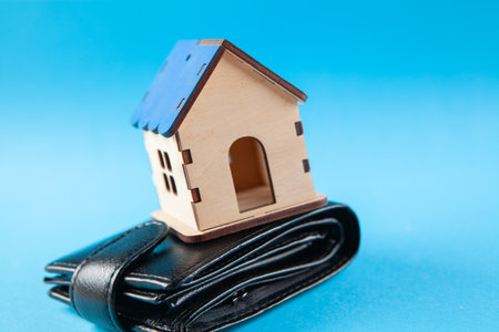 house on a wallet on a blue backgroundの写真素材