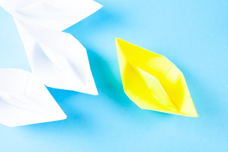 paper boats on a blue backgroundの写真素材