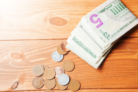 dollar bills and coins on the table