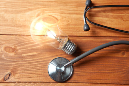 lamp and stethoscope on the tableの写真素材