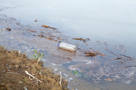 garbage on the lake during the day