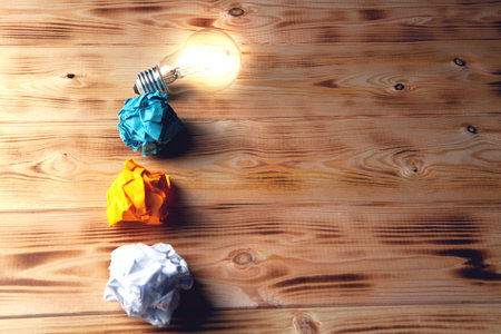 lamp and crumpled papers on the table. concept ideaの写真素材