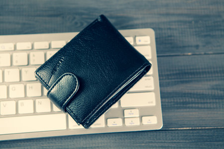black wallet on the keyboard. online shopping conceptの写真素材