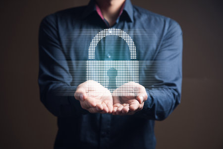 businessman holding a virtual padlock