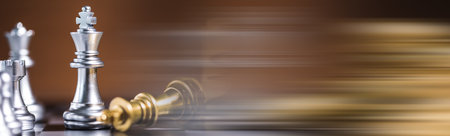 chess pieces on the board on the tableの写真素材