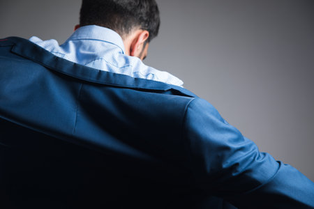 a man puts on a jacketの写真素材