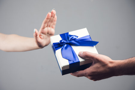 girl refuses to accept the gift boxの写真素材
