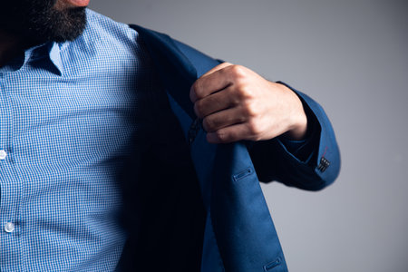 a man puts on a jacketの写真素材