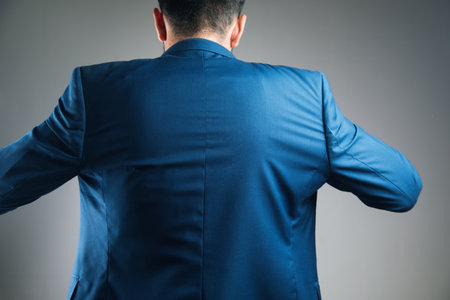 a man puts on a jacketの写真素材