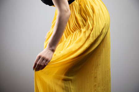 young woman straightens her dressの写真素材