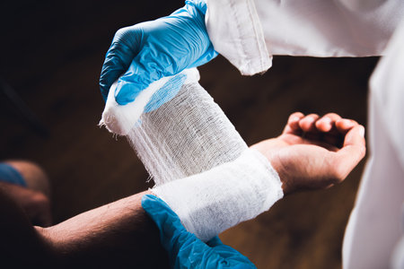 doctor bandages a man's hand.の写真素材