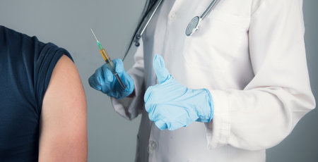 a doctor vaccinates a young guy
