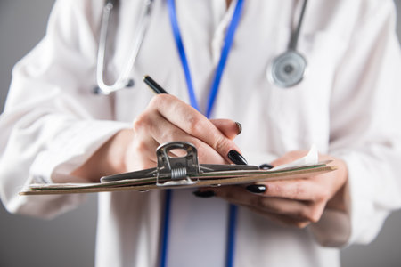 doctor taking notes in a clipboard