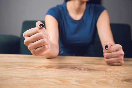 the woman hit the table with her fistの写真素材