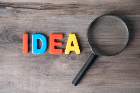 magnifying glass looks at the inscription ideaの写真素材