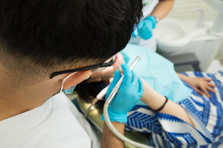 The dentist is performing the operation. healthy teethの写真素材